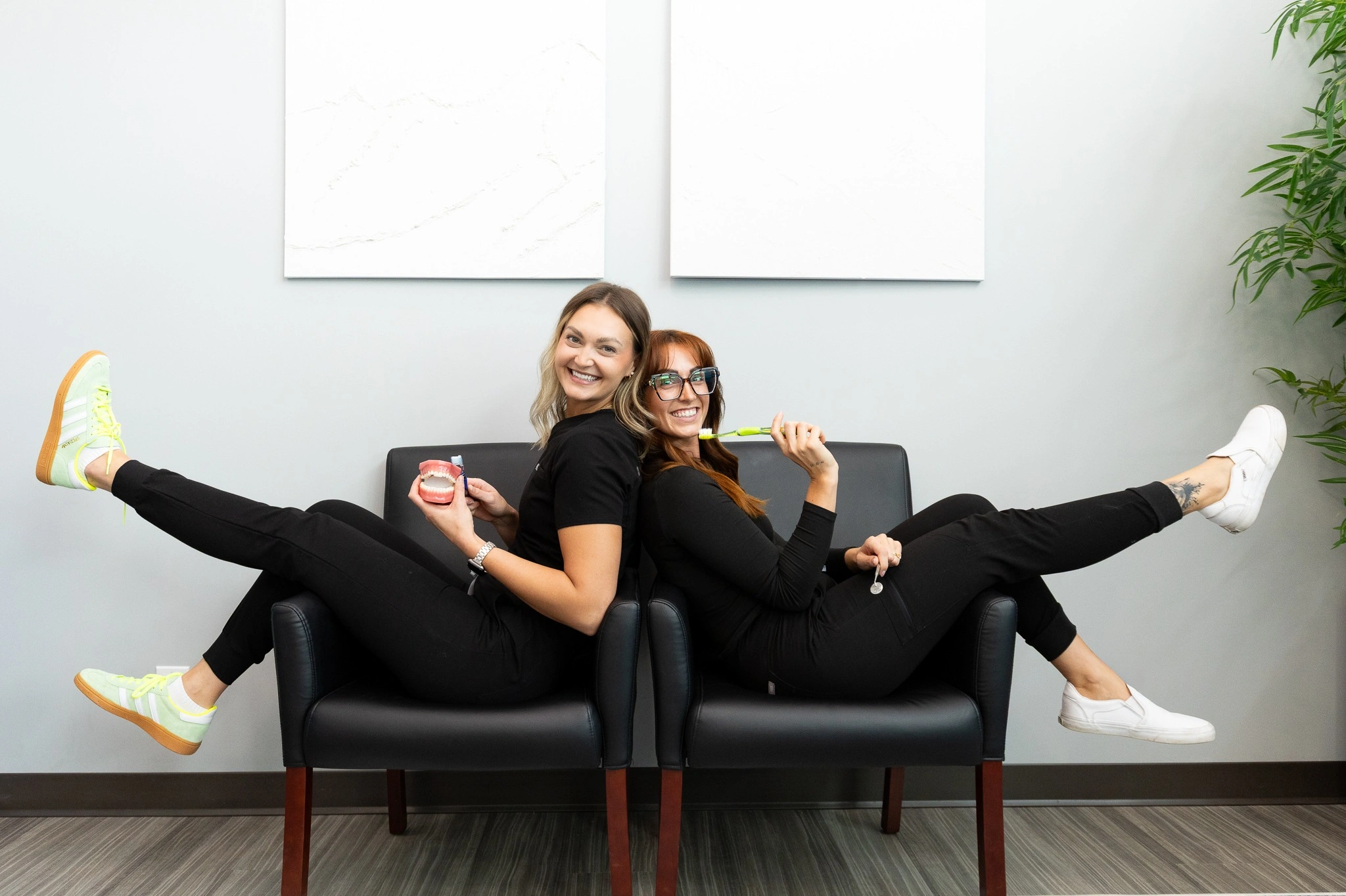 dental hygienists at smiling in their clinical scrubs