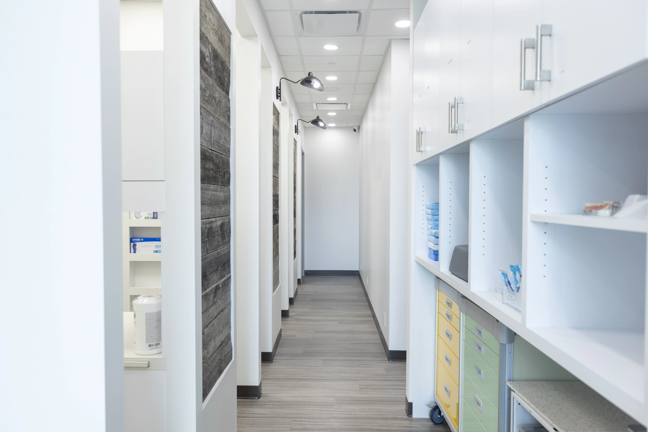 hallway at our clinic having private treatment rooms and storage cabinets