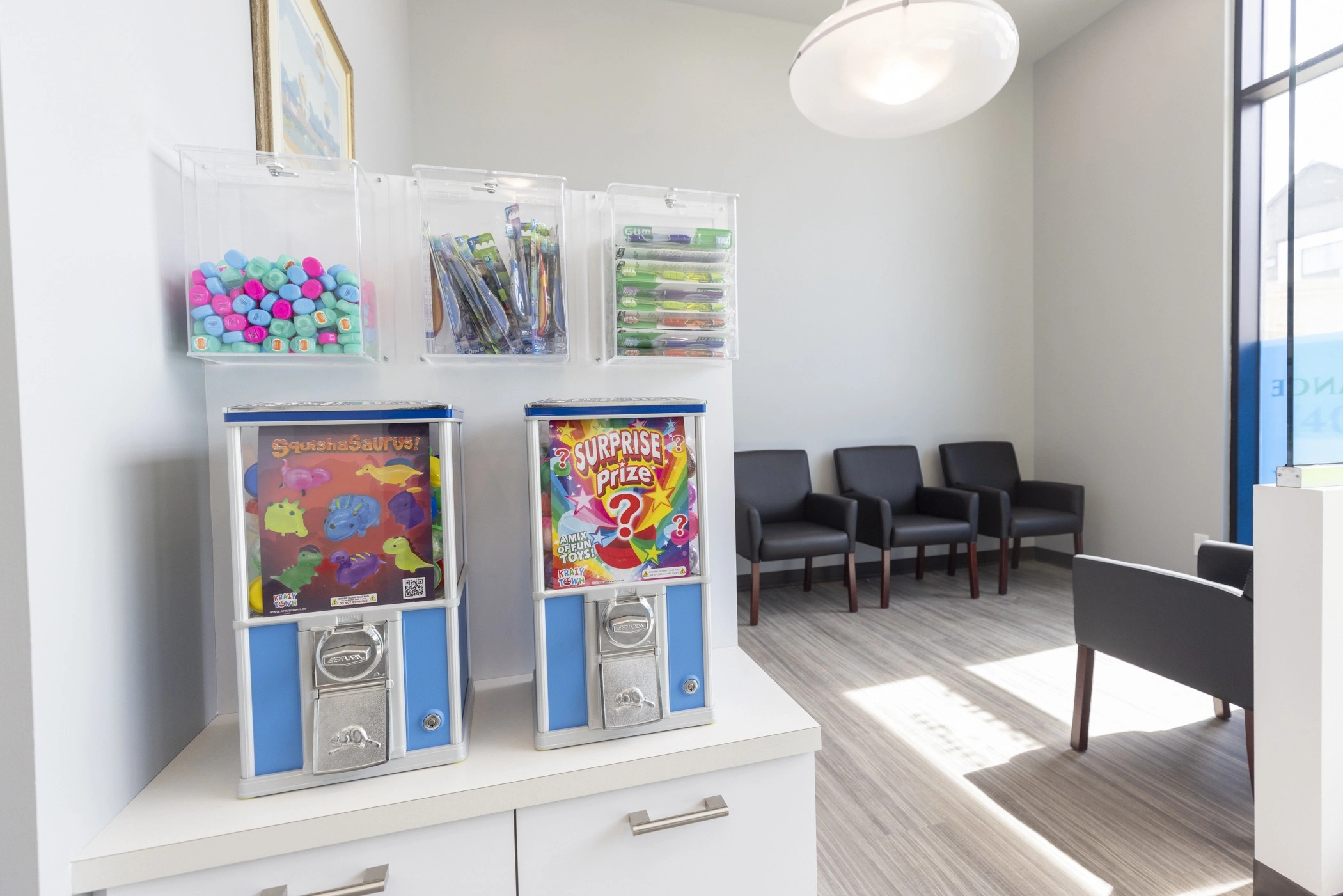 toy prize capsule machines and dental goodies in our clinic waiting room area